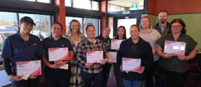 Cobb leadership programme graduates holding certificates