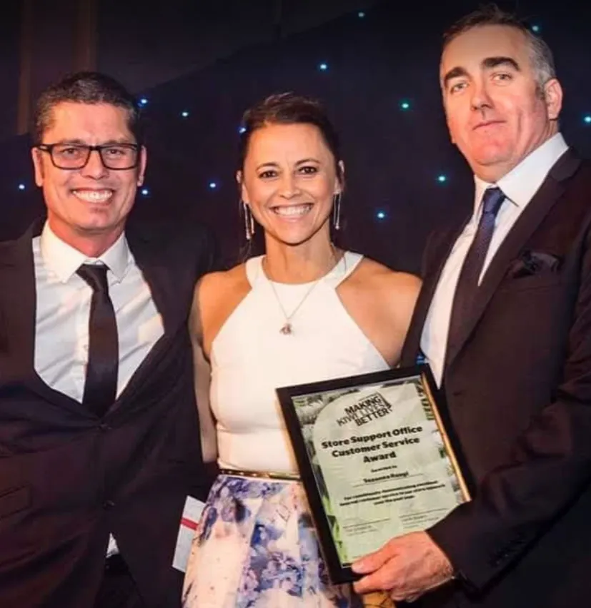Suzy Rangi on stage receiving the Store Support Office Customer Service Award